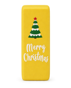 Butter yellow Christmas squishy brick with a Christmas tree and Merry Christmas print, standing upright